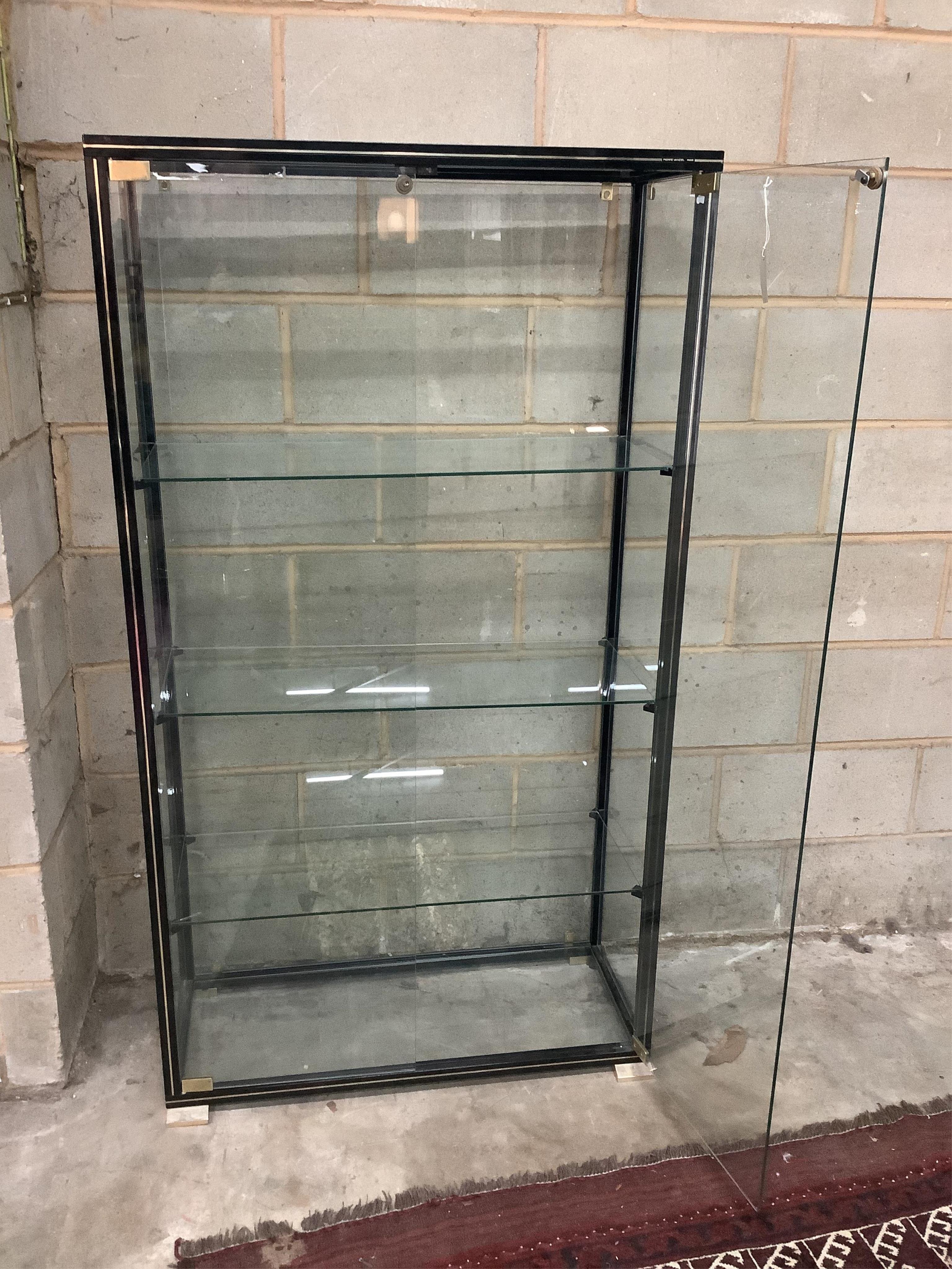 Pierre Vandel, a lacquered brass display cabinet, width 90cm, depth 37cm, height 163cm. Condition - good